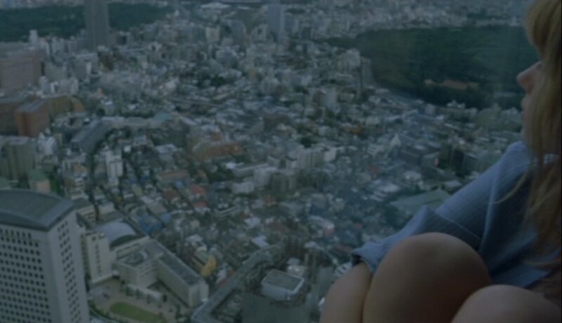 woman overlooking city from high vantage