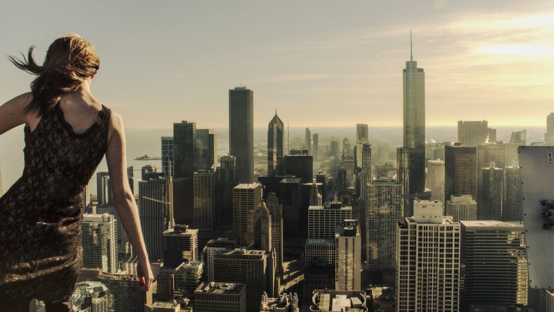 Woman overlooking city skyline