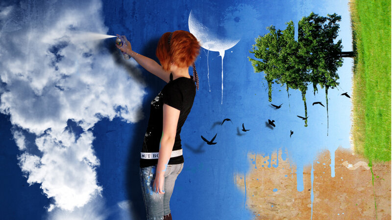 woman painting a surreal landscape