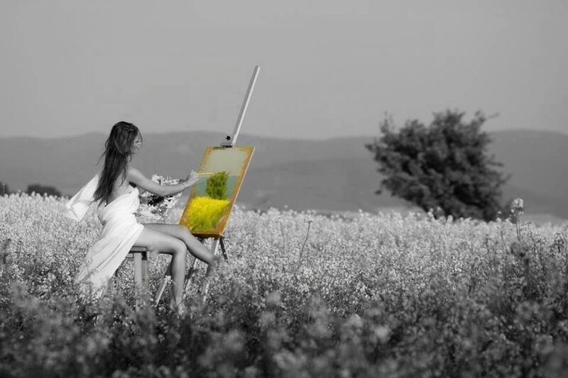 Woman Painting in Field