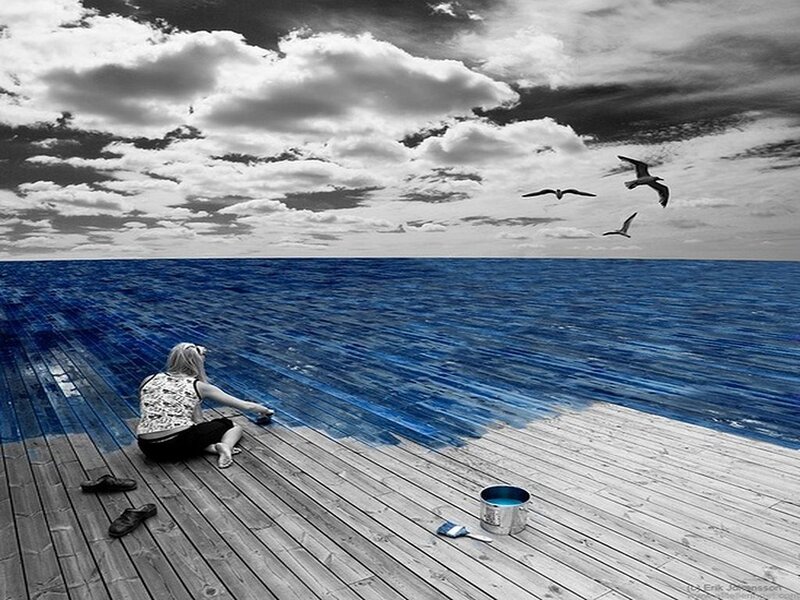 woman painting ocean blue