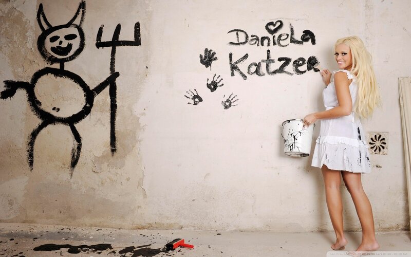 woman painting on a wall