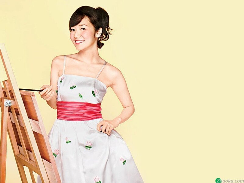 woman painting on easel