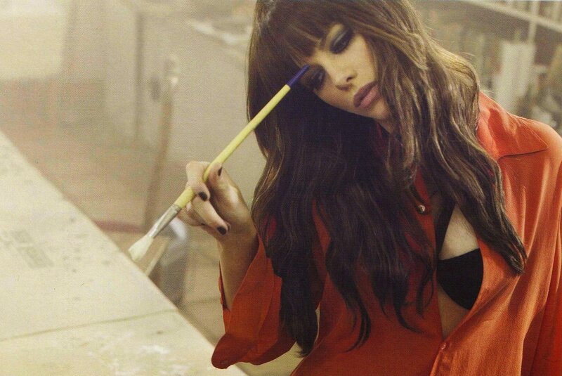 woman painting with brush