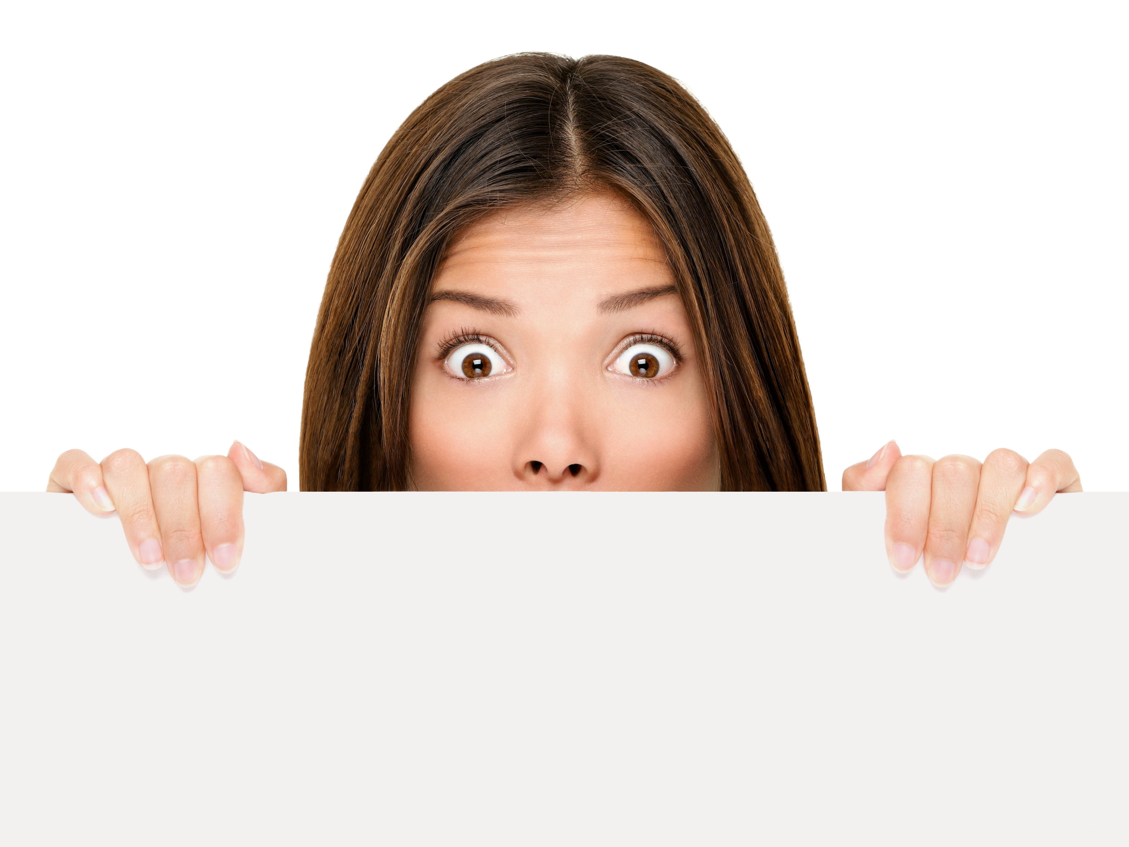 woman peeking behind sign