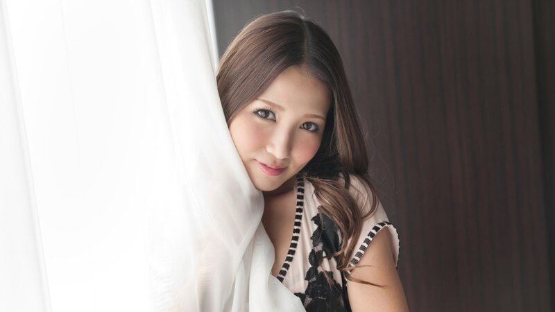 woman peeking from behind curtain