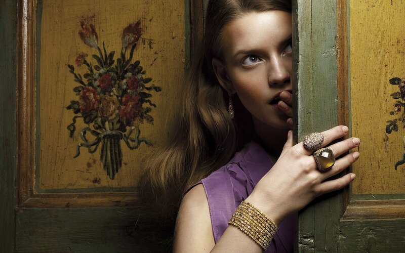 woman peeking from behind door