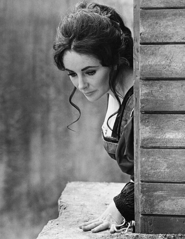 woman peeking from behind wall