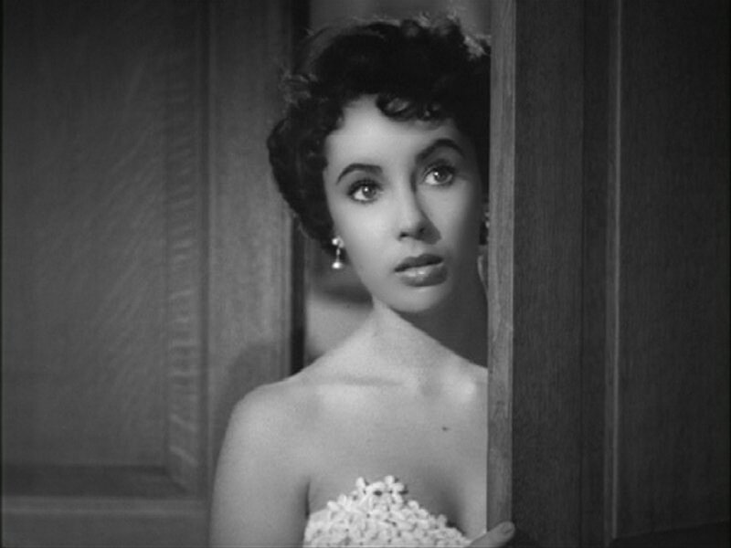 woman peeking from doorway