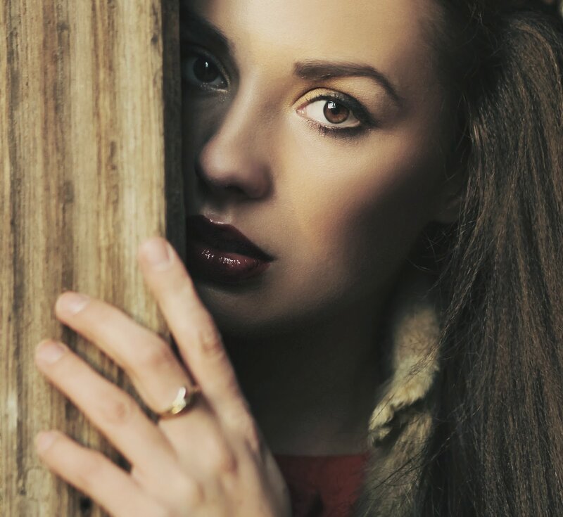 Woman Peeking from Wood
