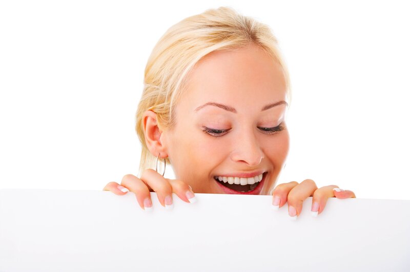 woman peeking over white board