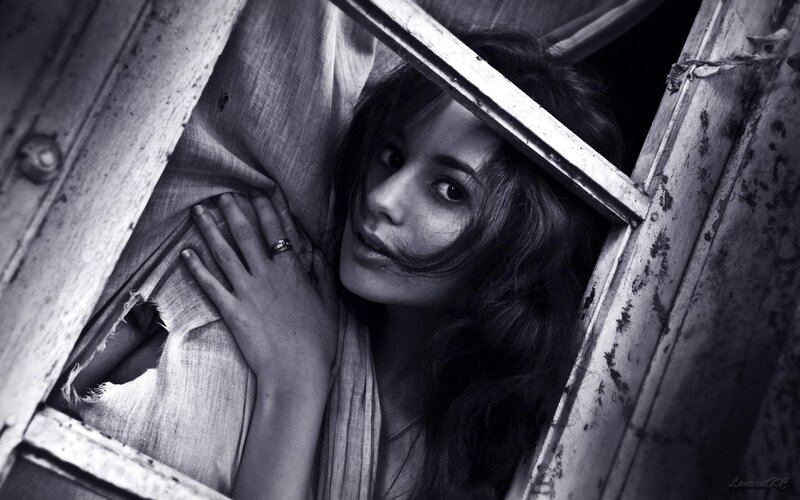 woman peeking through window