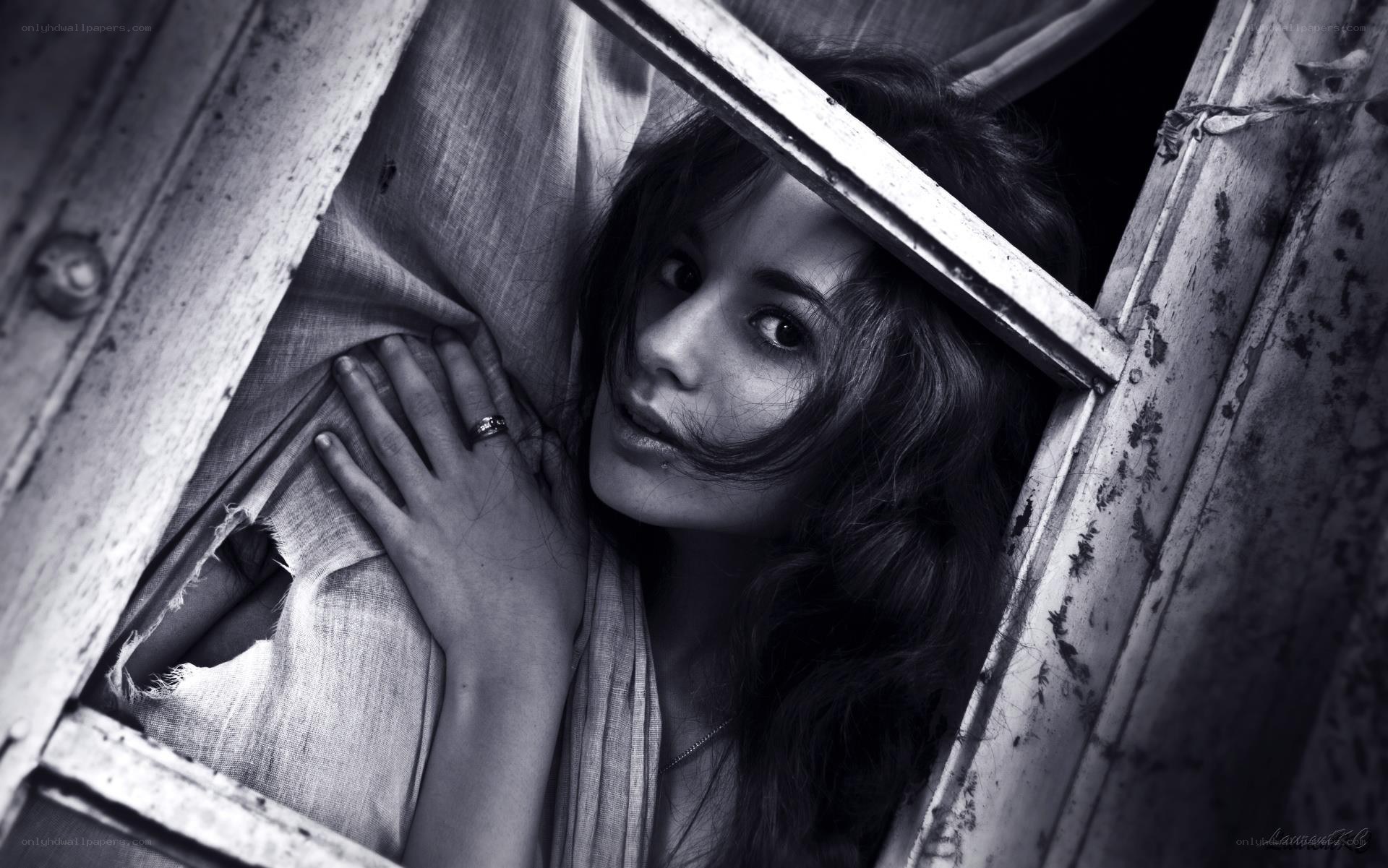 woman peeking through window