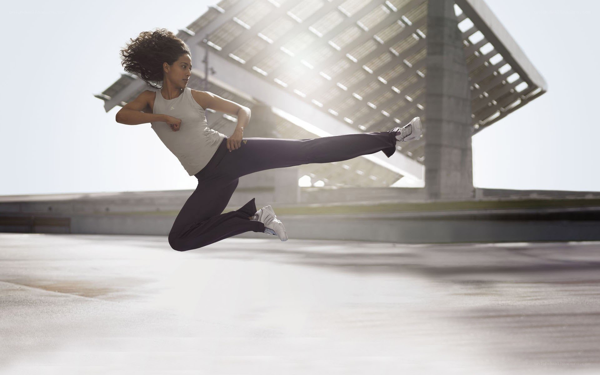 woman performing a high kick