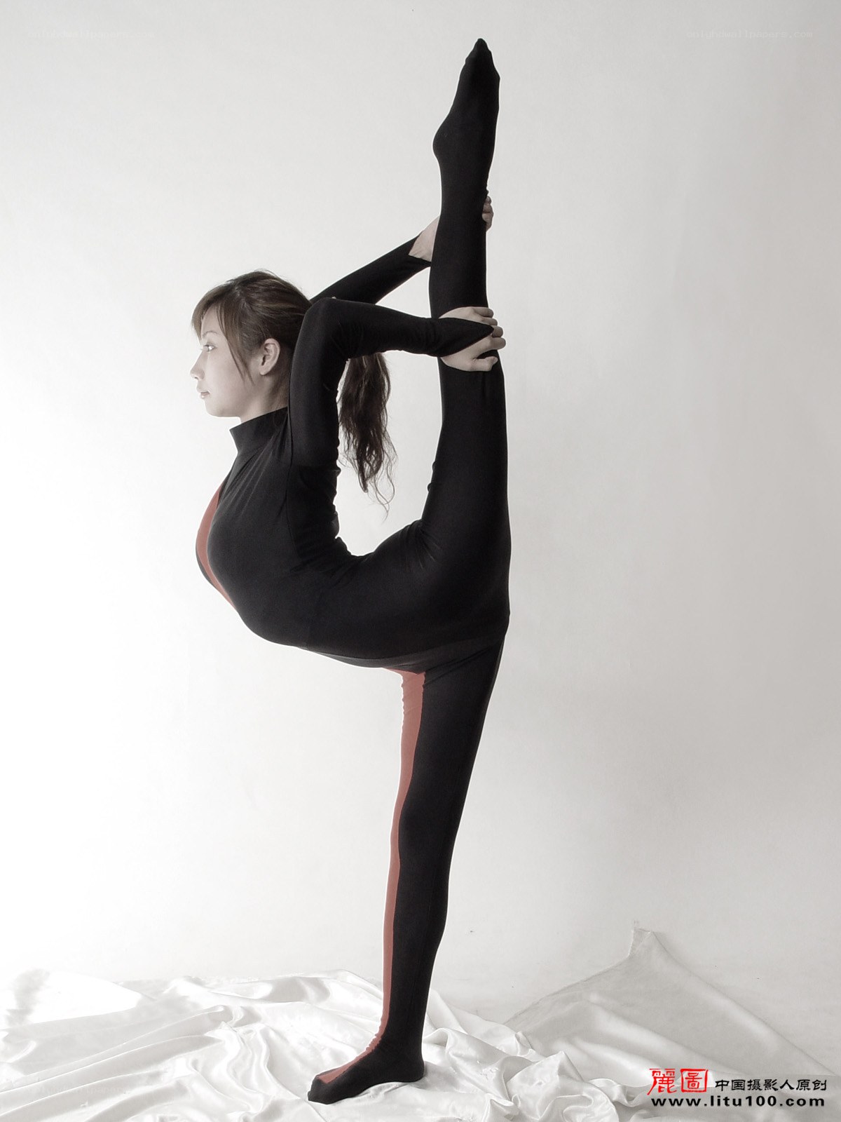woman performing a split