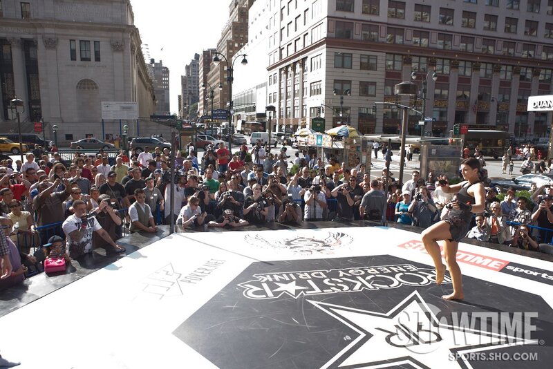 Woman performing kickboxing on stage