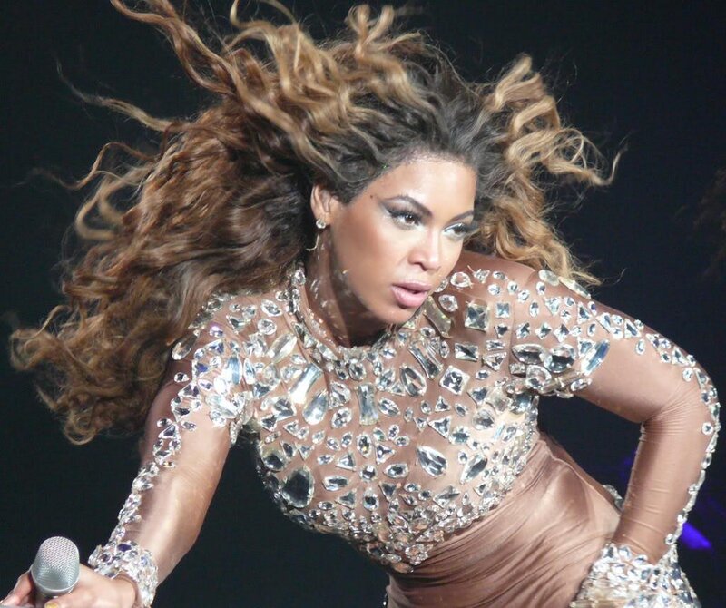 Woman Performing on Stage — Brown