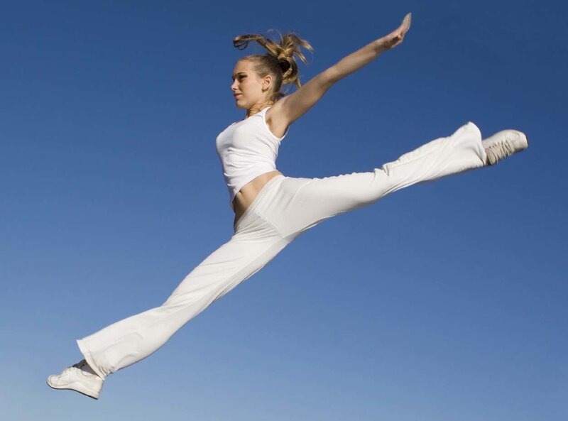 Woman Performing Split Jump