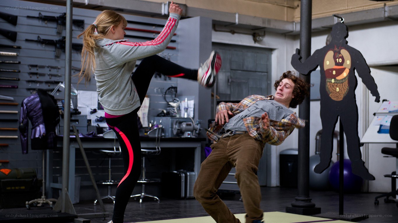 Woman performs high kick on man