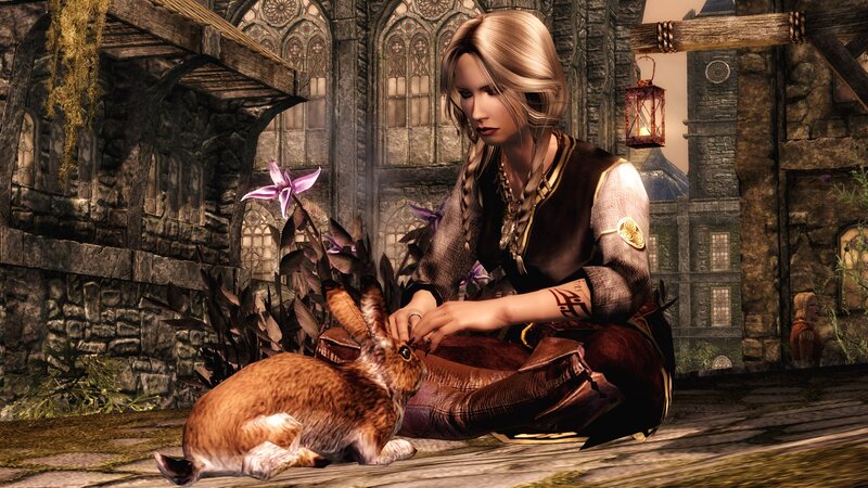 woman petting a rabbit