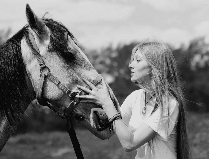 Woman Petting Horse