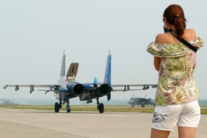 Woman Photographing Jet