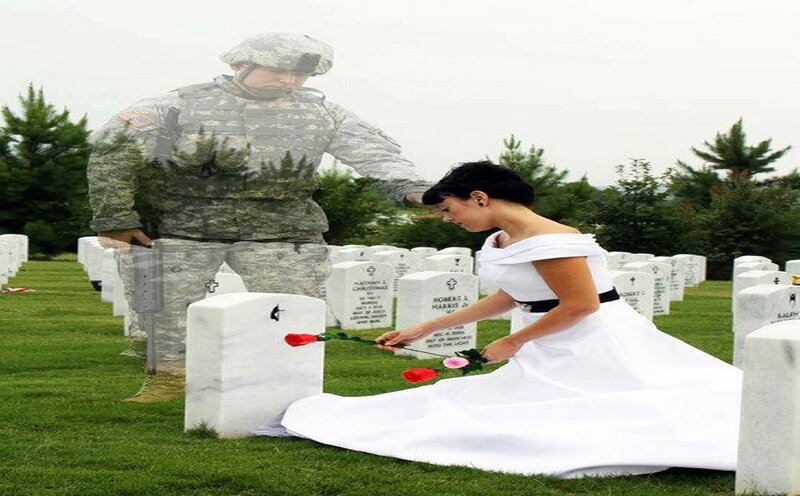 Woman Placing Flowers at Grave