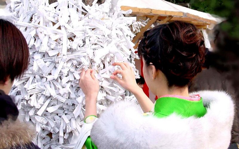 woman placing paper strips