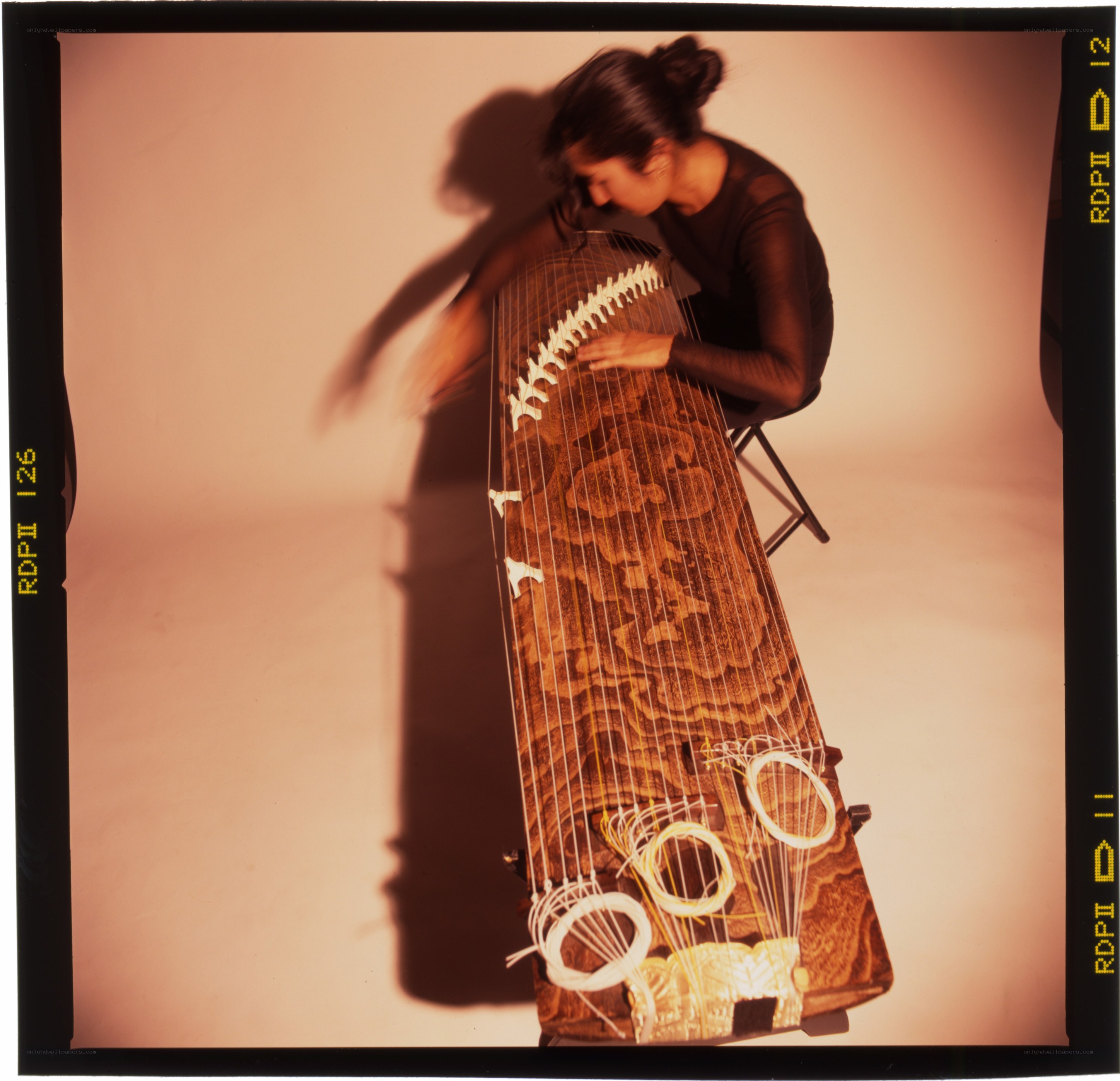 Woman playing a zither