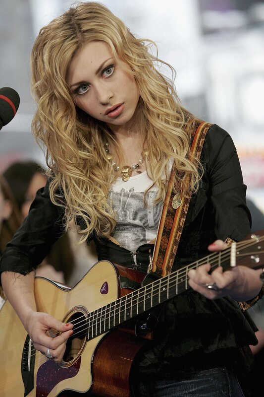 woman playing acoustic guitar