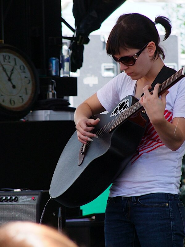 Woman playing acoustic guitar