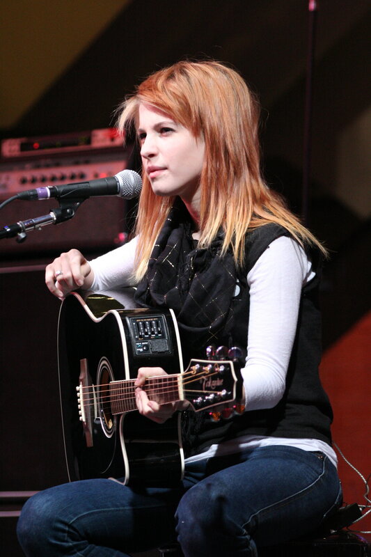 woman playing acoustic guitar