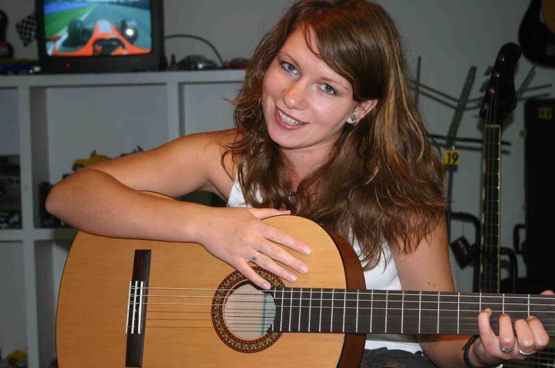 woman playing acoustic guitar
