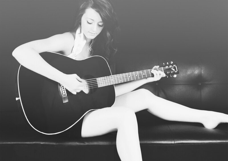 woman playing acoustic guitar