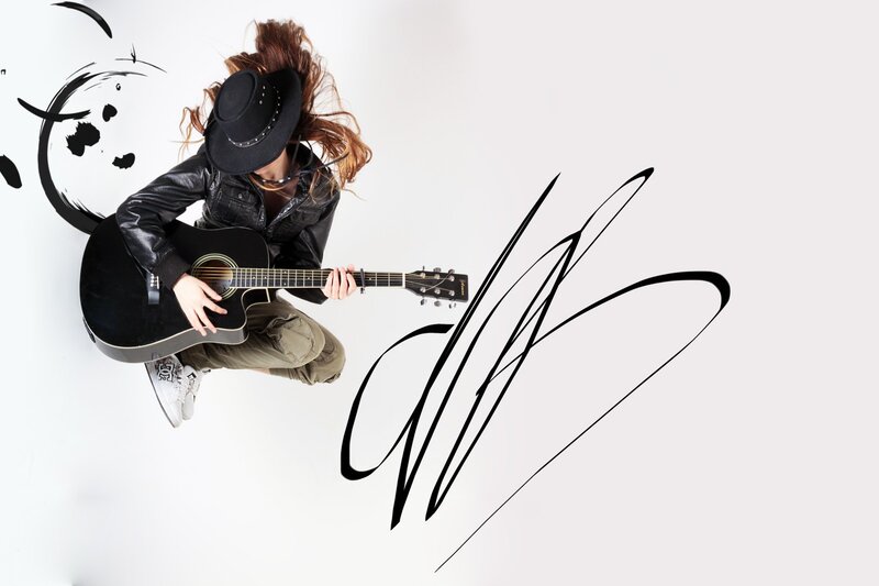 woman playing acoustic guitar