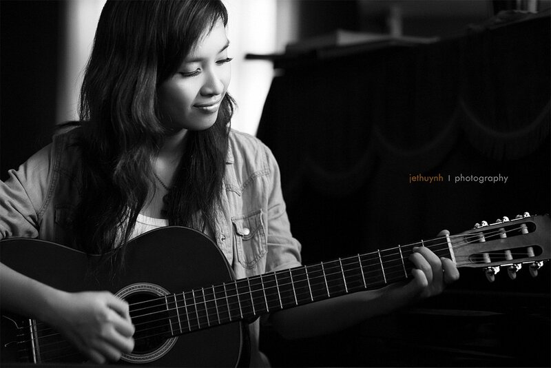 woman playing acoustic guitar