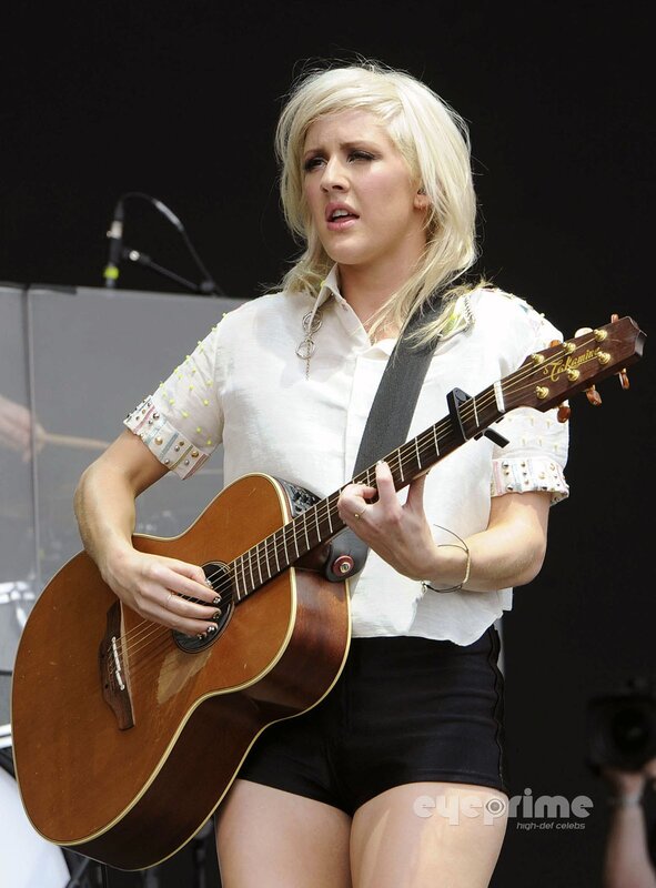 Woman playing acoustic guitar