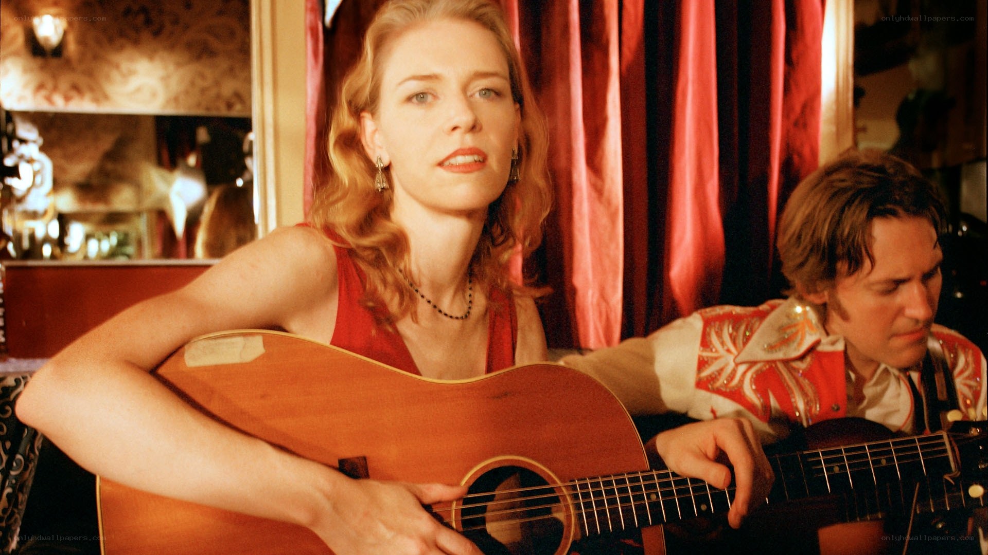 woman playing acoustic guitar