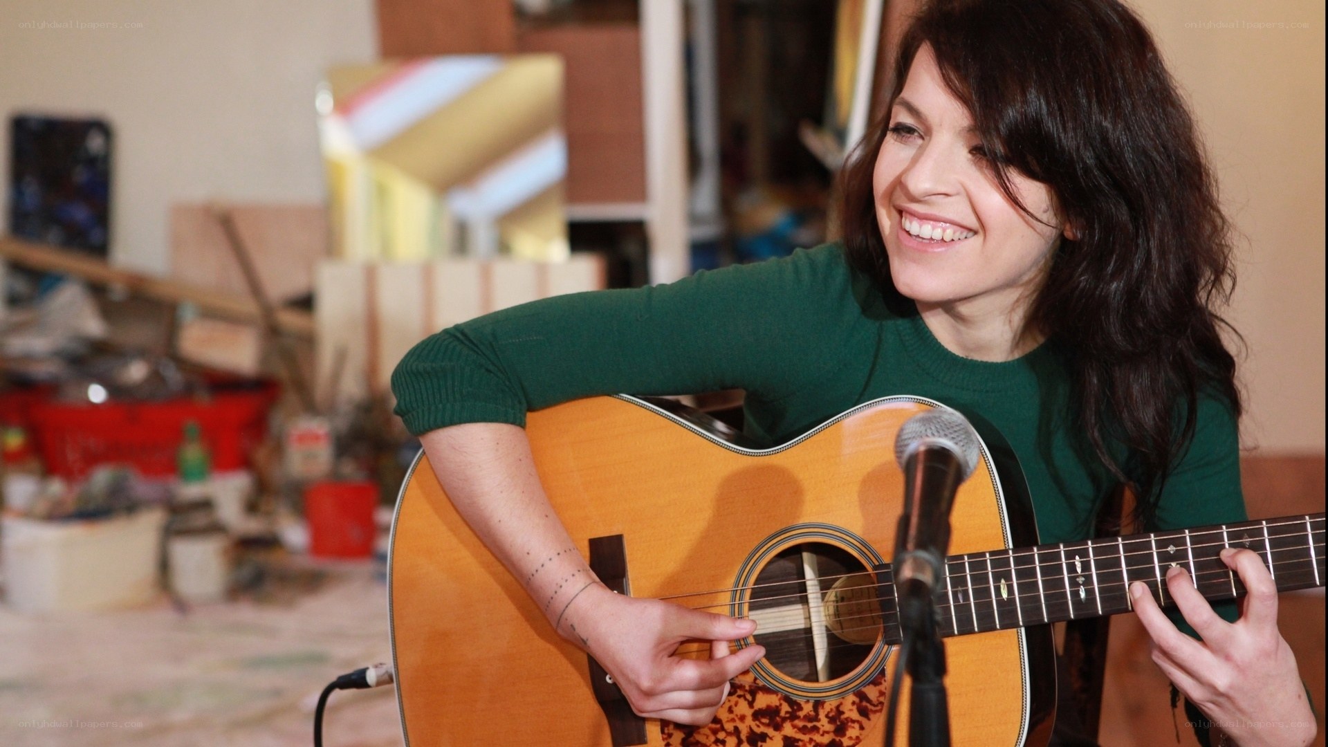 woman playing acoustic guitar