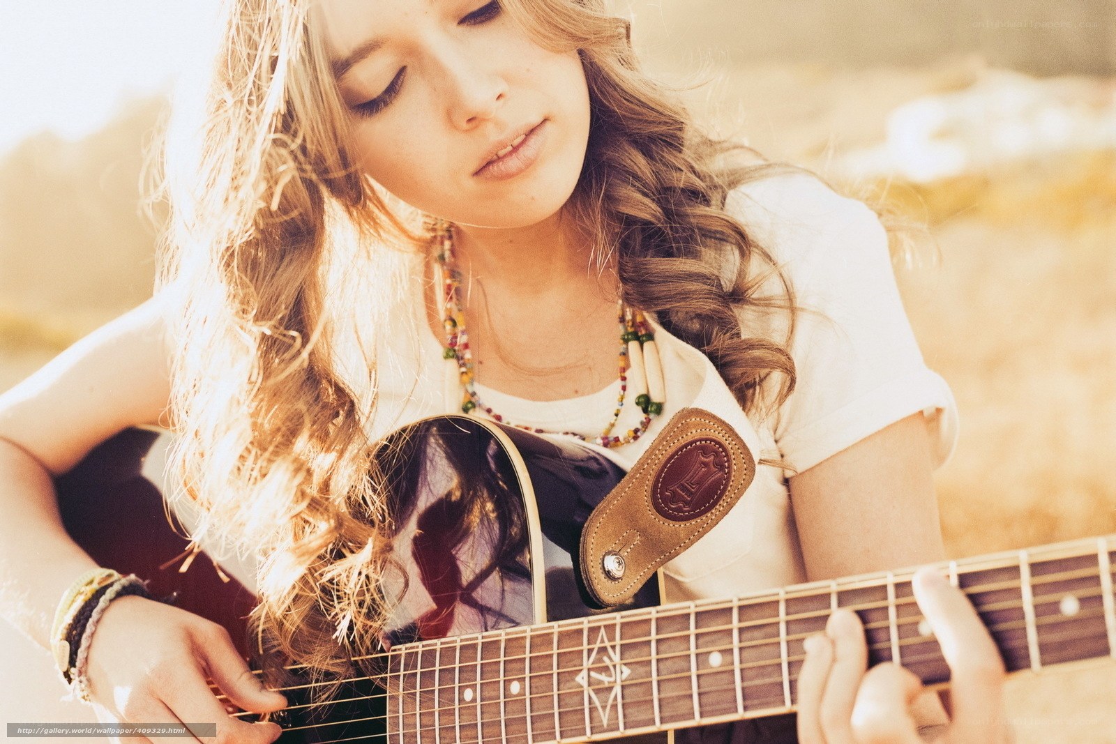 woman playing acoustic guitar