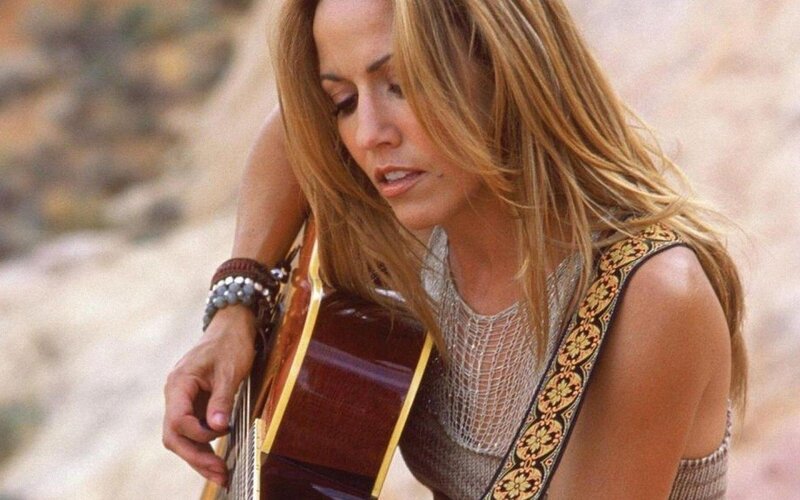 woman playing acoustic guitar