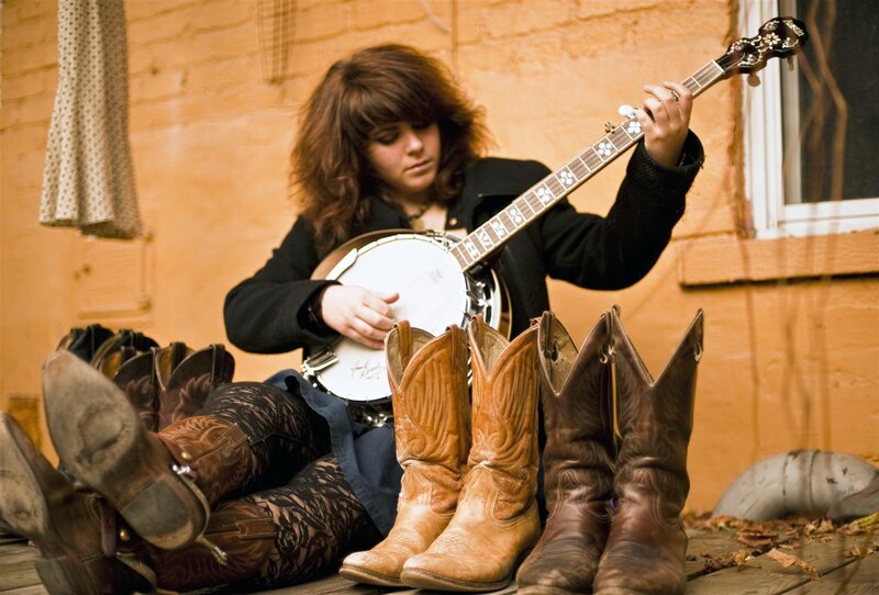 Woman Playing Banjo — Brown