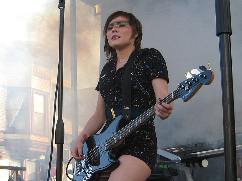 Woman Playing Bass Guitar — Black, Energetic, Afternoon