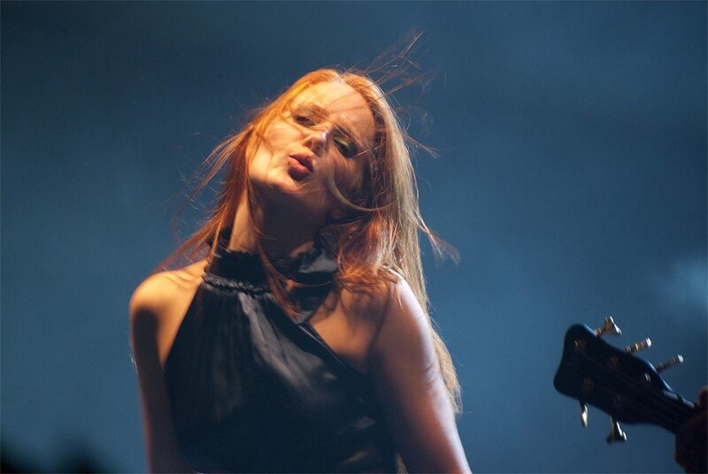 Woman Playing Bass Guitar — Blue