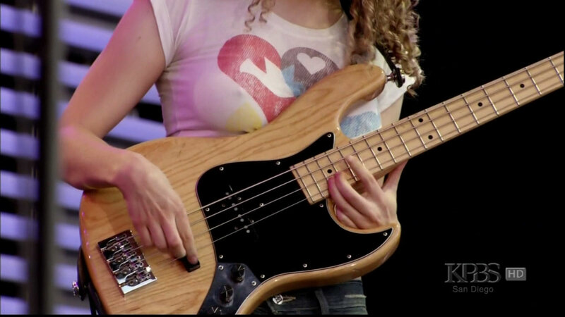 Woman Playing Bass Guitar — Brown