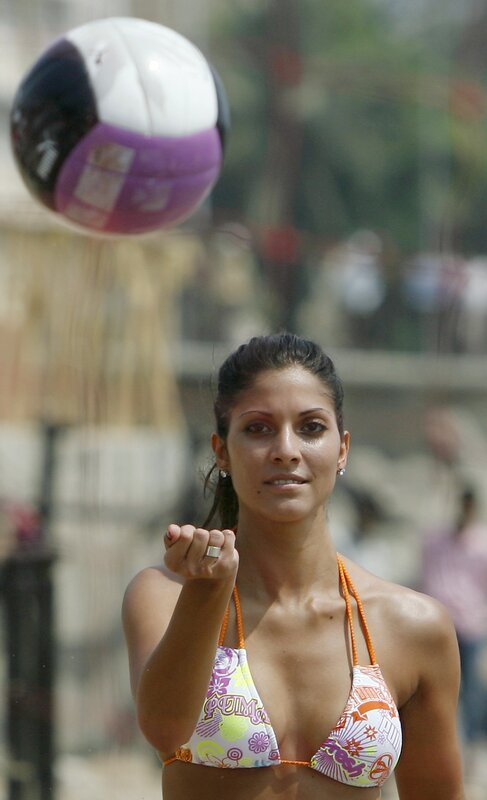 woman playing beach volleyball