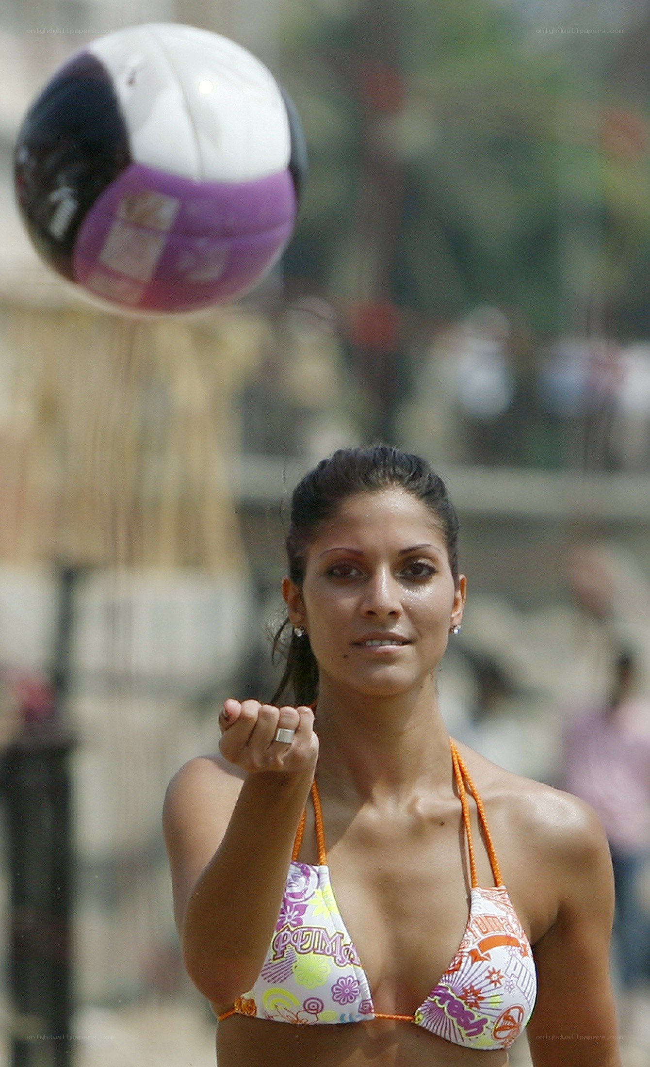 woman playing beach volleyball