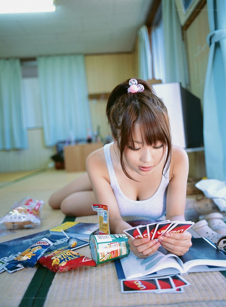 woman playing cards on floor