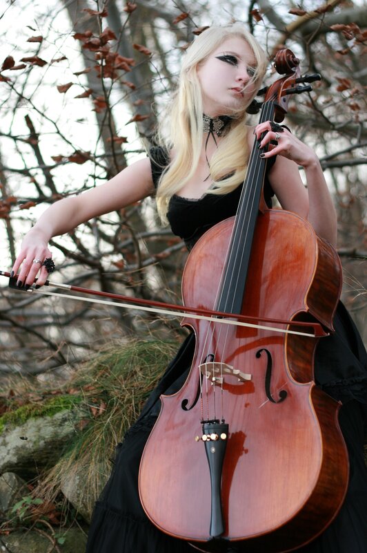 Woman playing cello outdoors