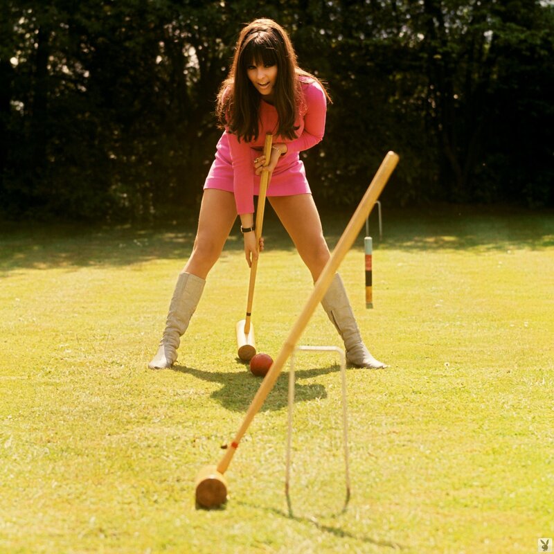 Woman playing croquet in pink
